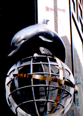 dolphin over a globe